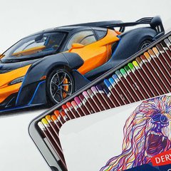 Realistic Car Drawing of an orange mclaren sabre Made With derwent coloursoft colored pencils
