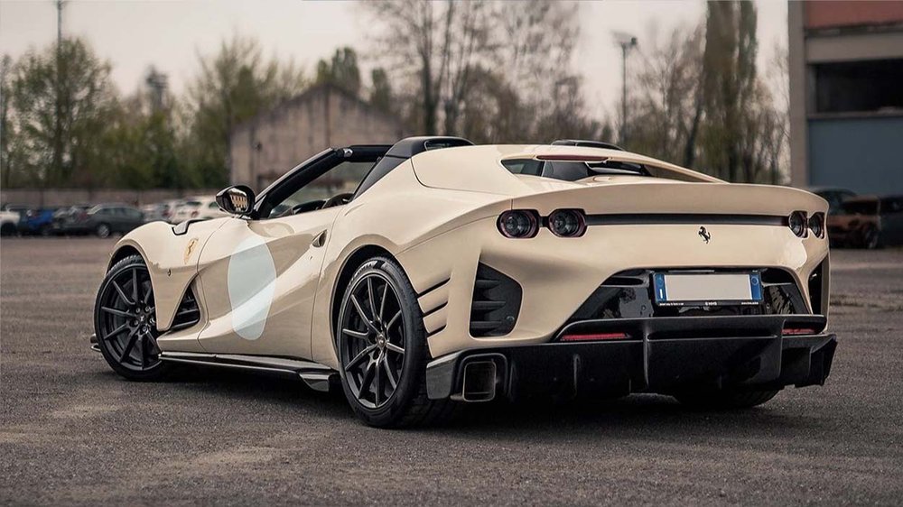 photo of a ferrari 812 competizione aperta from the rear and the side. A good example of a reference photo for a realistic car drawing - car drawing tips