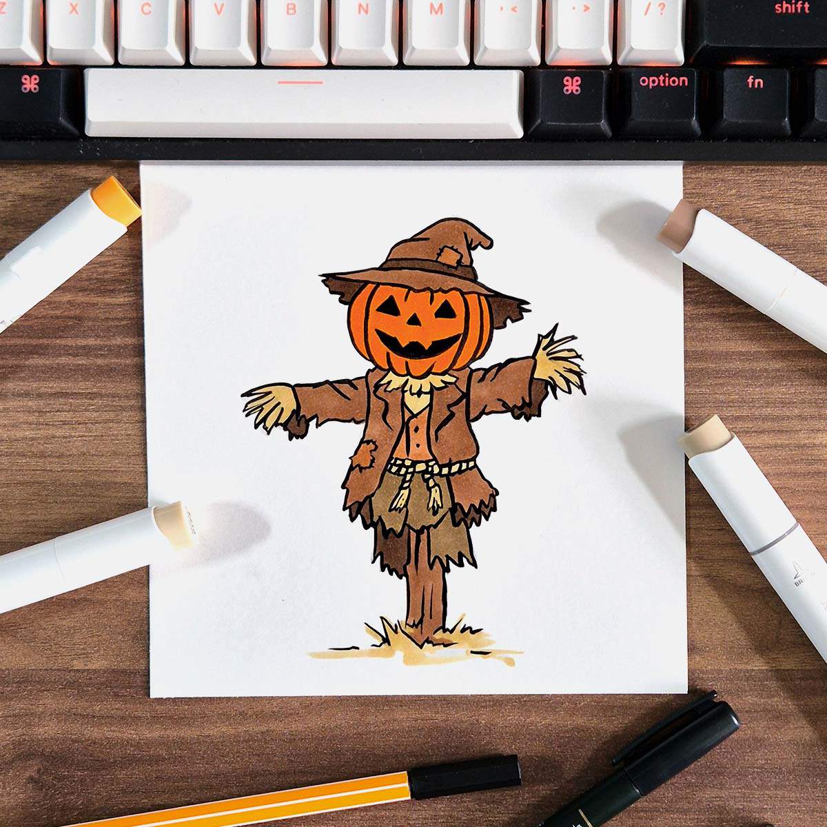 marker drawing of a scarecrow with a pumpkin head