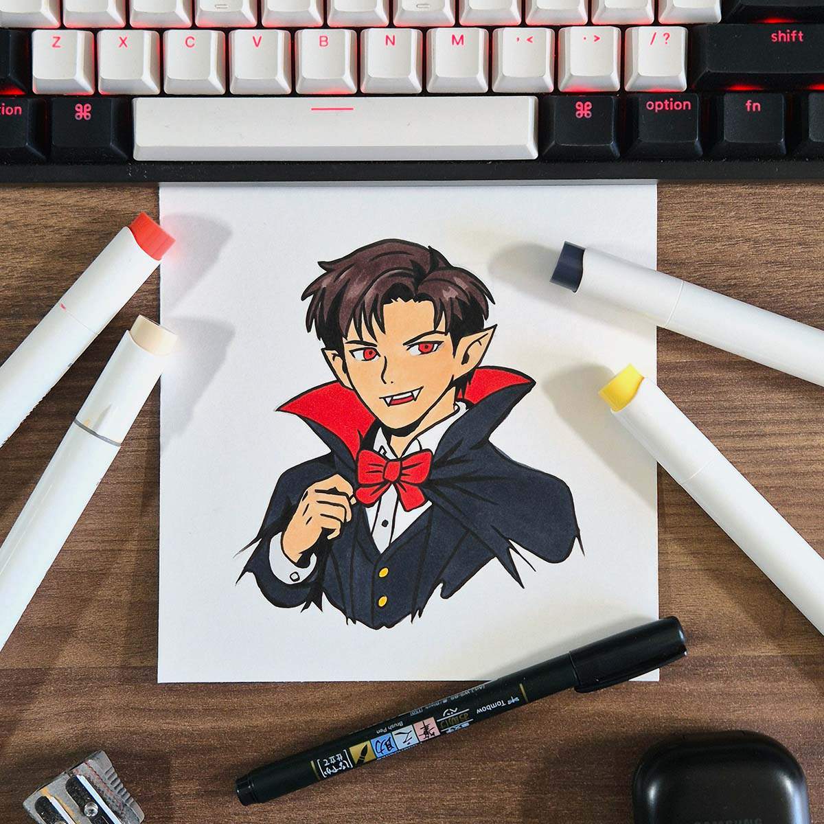 marker drawing of a vampire with sharp fangs and a high collared cloak