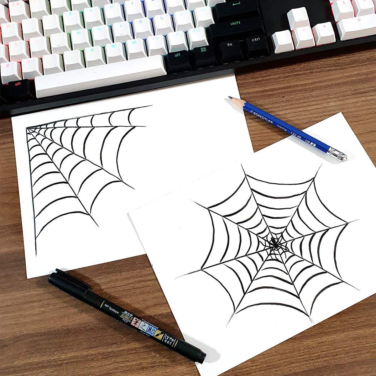 brush pen drawing of some simple and spooky spider webs