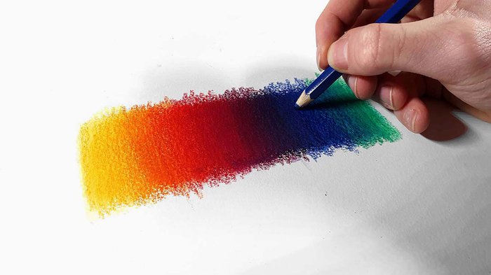 multiple colored pencils blended together in rainbow order - tips for beginners