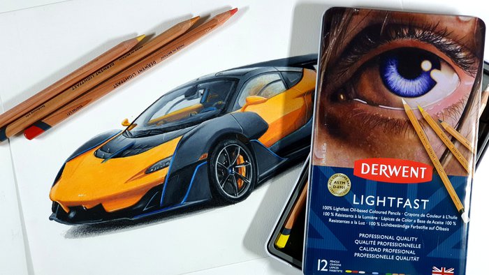 best oil-based colored pencils - drawing of a car mclaren sabre in orange next to a box of derwent lightfast colored pencils