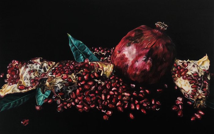 realistic colored pencil drawing of a moody still life with pomegranate