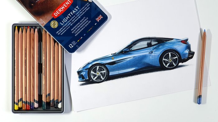 drawing of a car ferrari portofino in blue next to a box of derwent lightfast colored pencils - best oil-based colored pencils